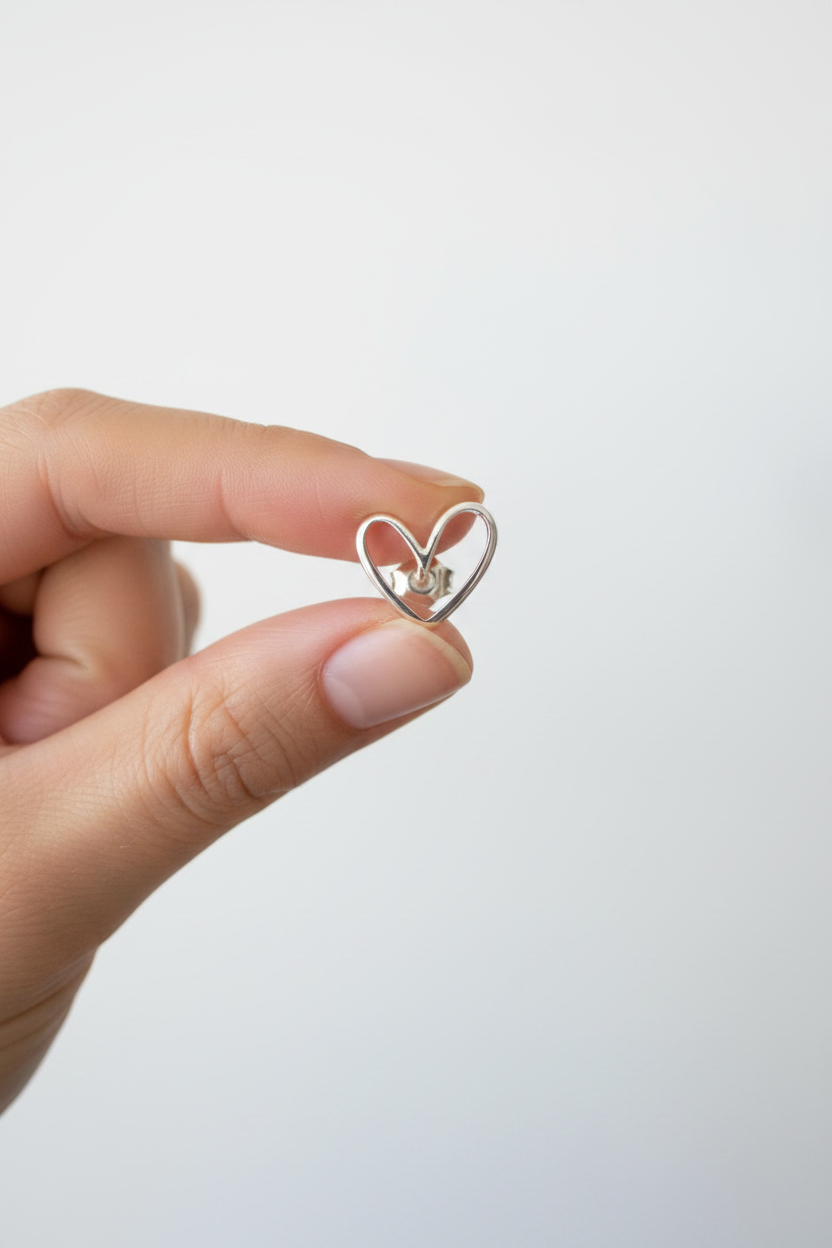 Hand Holding 925 Sterling Silver Heart Stud