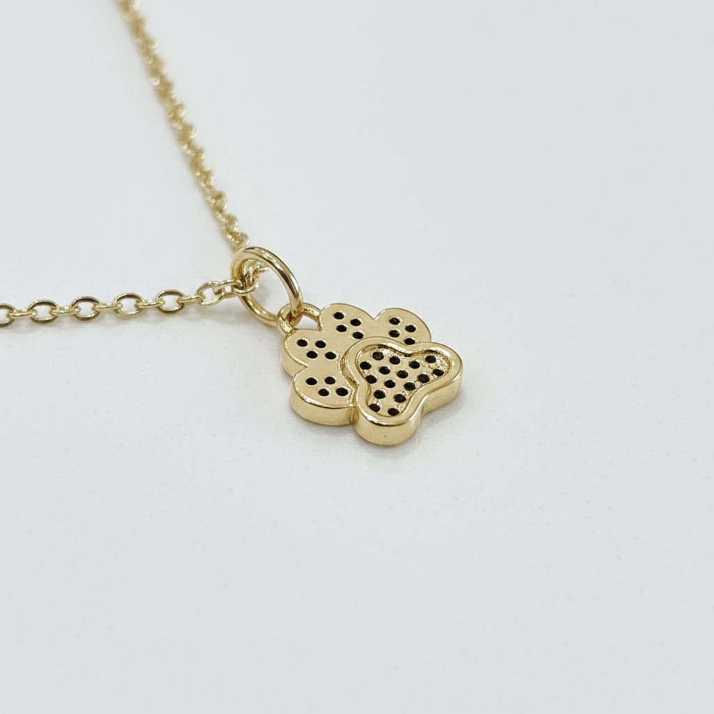 Improved image 2 - close-up gold flower charm on white background